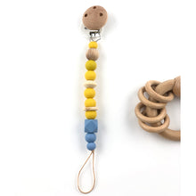Cargar imagen en el visor de la galería, Chupeteros Silicona y madera Anillas Azul Zen y Mostaza