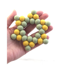 Cargar imagen en el visor de la galería, Mordedor estrella tono verde y mostaza