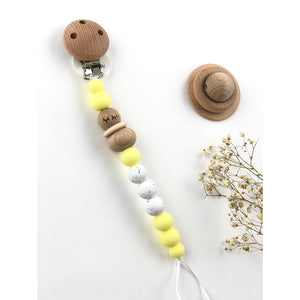 Chupetero silicona y madera amarillo bebé